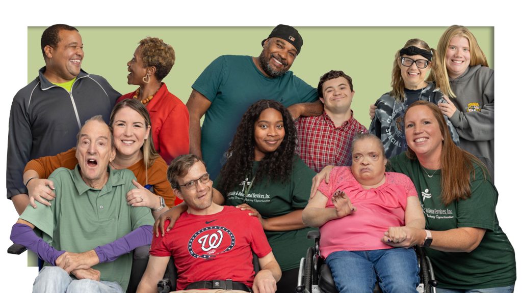 A group of adults with disabilities and staff members smile and pose together, highlighting inclusion, connection, and community in a supportive environment.